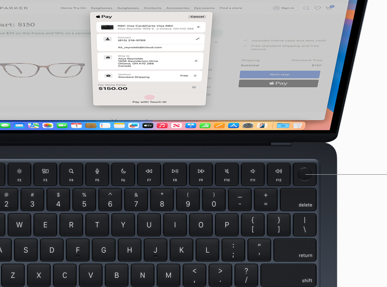 MacBook Air showing user authorizing payment for online shopping purchase using Touch ID