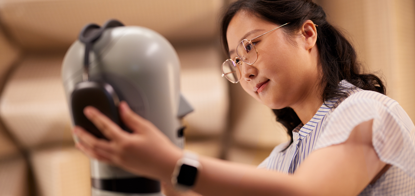 Two Apple engineers work on iPhone components in a lab