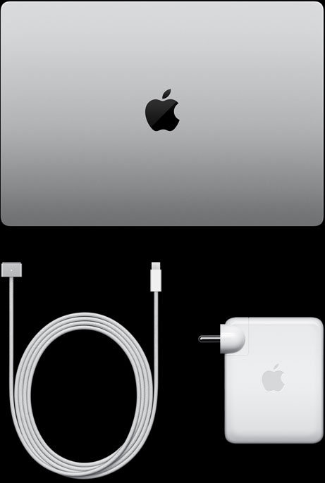 MacBook Pro, silver colour, top, closed, next to charging cable and adapter