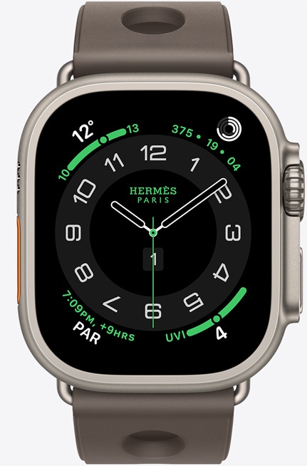 Apple Watch Hermès Ultra 3, titanium case, natural color, Hermès Circulaire watch face, complications: weather, activity rings, Paris time, UV index, right side exterior, Digital Crown, microphone, raised side button, Scub'H Diving band, gris titane color