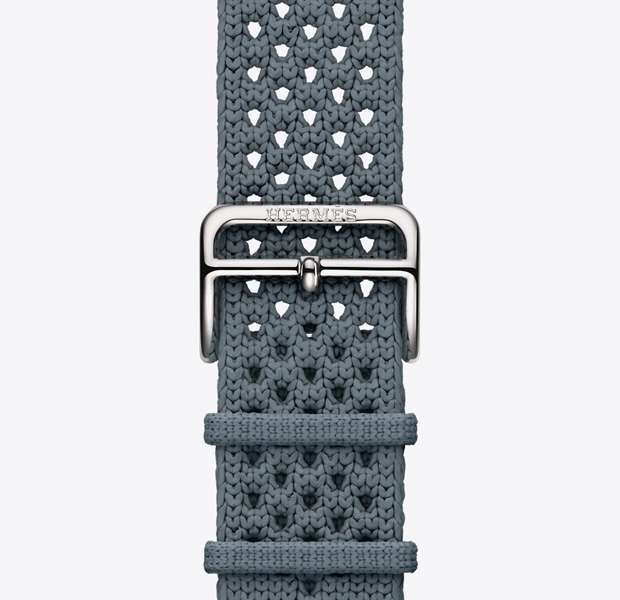 Apple Watch Hermès Series 11 Néo Tricot band, bleu gris color (blue gray), knit polyamide yarn material, adjustment holes centered, silver color buckle closure engraved with Hermès