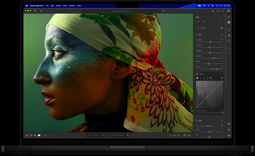 Screen of MacBook Pro of a photo of a woman being edited in Adobe Lightroom