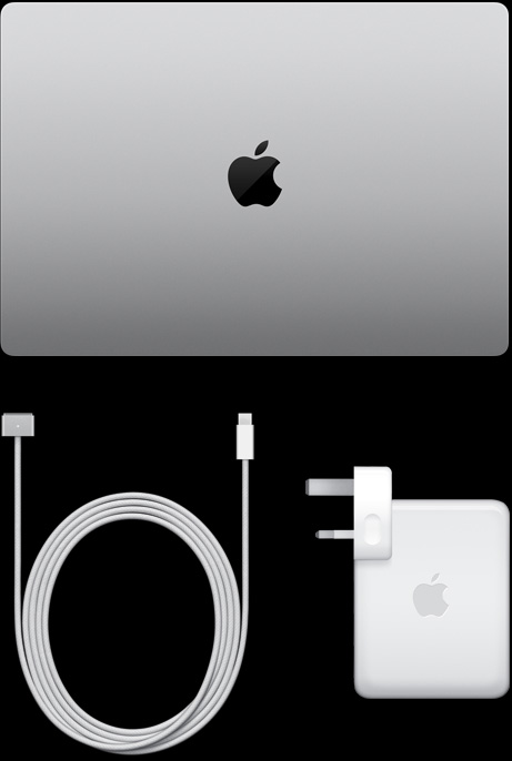 ‏‏MacBook Pro، لون فضي، الجانب العلوي، مغلق، بجانب كابل شحن ومحول طاقة