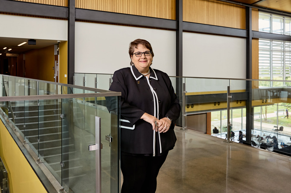 Dr. Madeline Burillo-Hopkins works with participants at the Houston Community College technology summer camp.