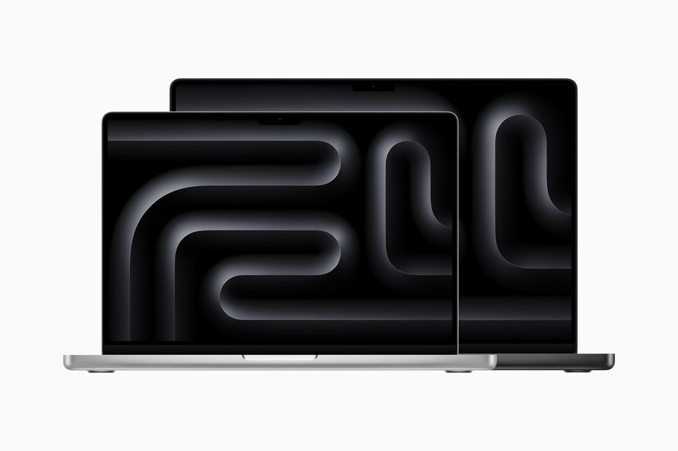 Gümüş ve Uzay Siyahı renklerinde birer MacBook Pro gösteriliyor.