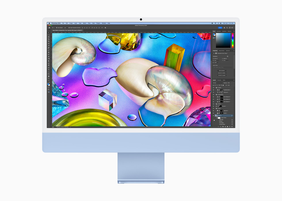 Mavi bir iMac’te bir kullanıcı Photoshop kullanıyor.