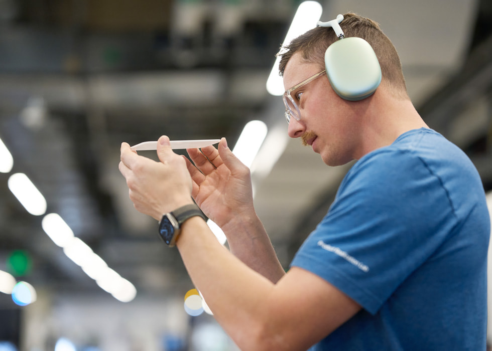 A worker wearing headphones at Apple’s R&D facility in Austin.