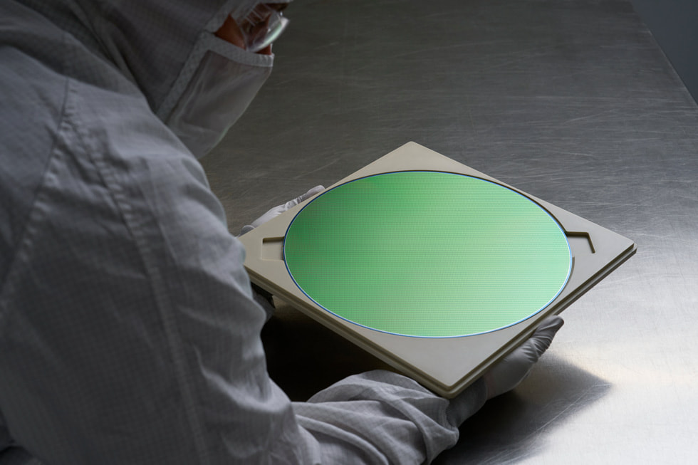 A worker at Texas Instruments’ semiconductor wafer fabrication plant in Lehi, Utah.