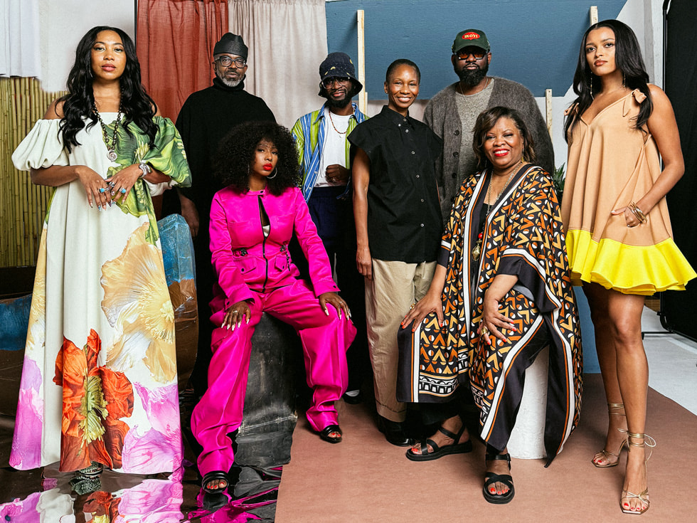 A group shot of designers Sasha Flynn, Aaron Potts, Samantha Black, Niyi Okuboyejo, Nicole Benefield, Ade Okuboyejo, Shawna McGee, and Larissa Muehleder.