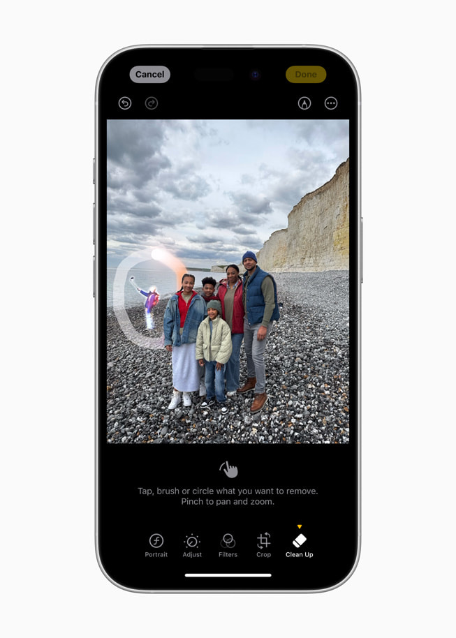 iPhone 16 shows Clean Up removing a bystander in the background of a photo.