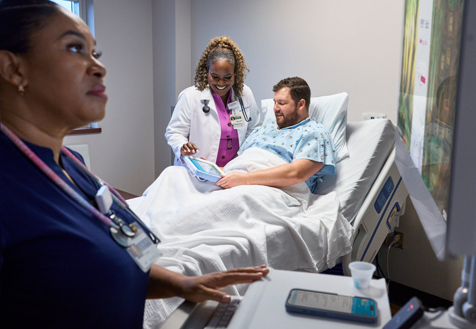 Dr. Rashida La Barrie assists a patient at Hillandale Hospital as they use iPad.
