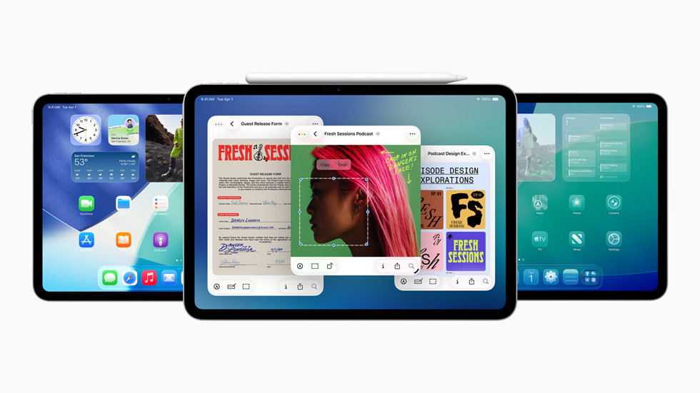 Three iPad devices show new features available in iPadOS 26. An Apple Pencil sits on the top of the middle device.