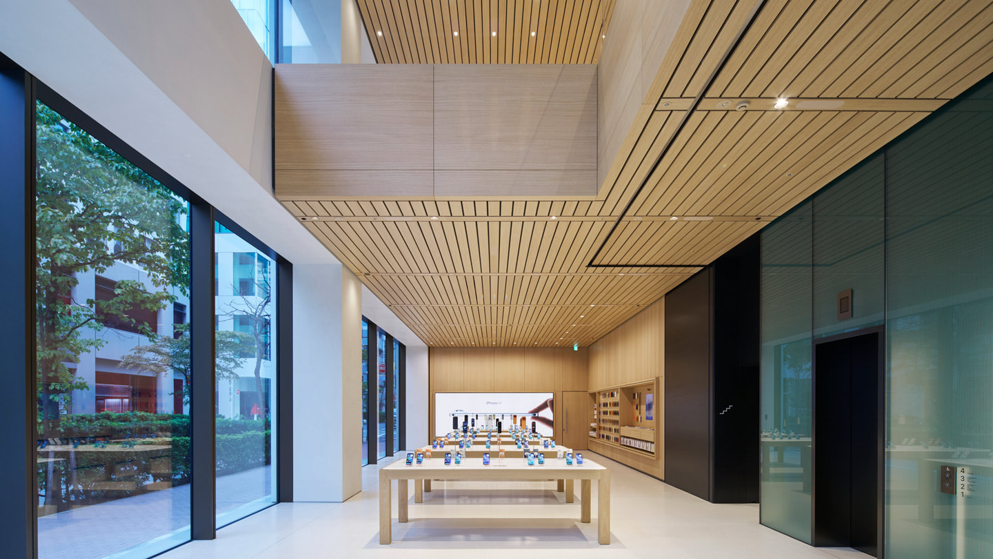 An interior view of Apple Ginza shows multiple display tables.