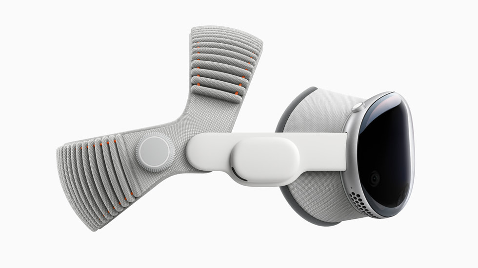Apple Vision Pro vu de côté, avec bandeau tissé à sangle double.