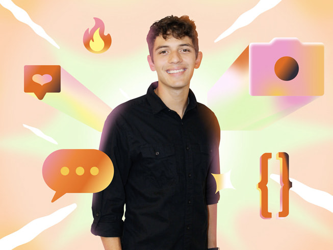 Brayden Gogis is standing up and smiling. He is wearing a black button down shirt.