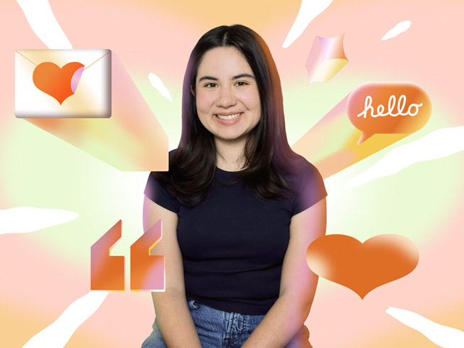 Sofia Sandoval is in a seated position, smiling while wearing a black T-shirt and jeans.