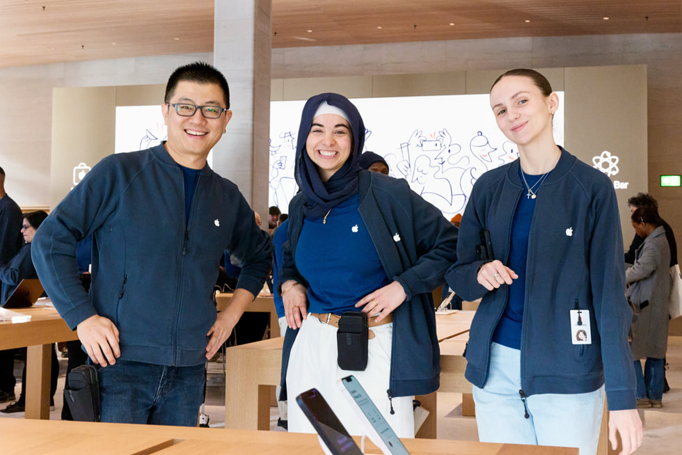 Three team members pose for a photo at Apple Sainte-Catherine.