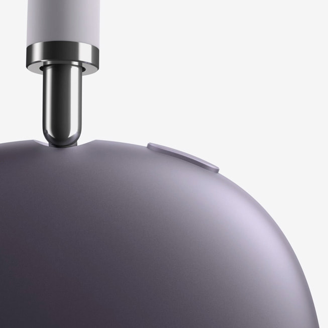 A closeup of AirPods Max 2 in purple.