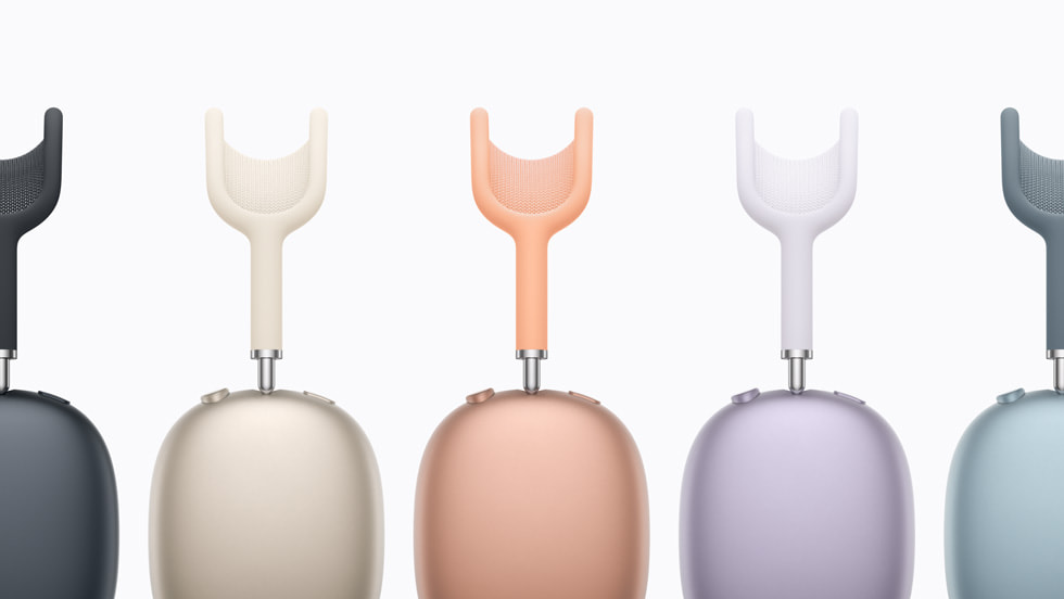 Five AirPods Max 2 devices are shown in a row, showcasing the full color lineup, from left: midnight, starlight, orange, purple, and blue.