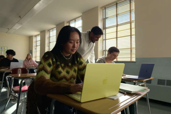 Students use a MacBook Neo in a classroom setting.