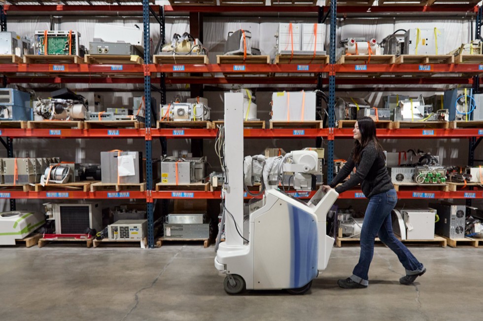A person transports an X-ray machine at the Block Imaging facility.