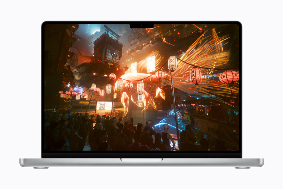 The game Cyberpunk 2077: Ultimate Edition on a 14-inch MacBook Pro shows a first-person view of other game characters in a shiny, futuristic setting.