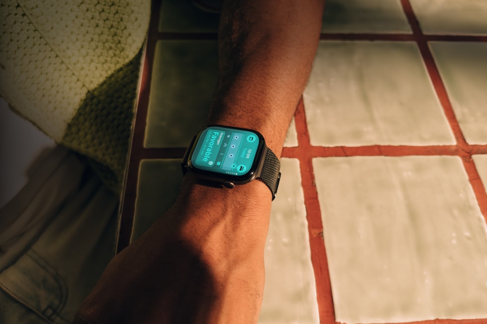 A closeup of a user’s arm shows Apple Watch Series 12 on their wrist.