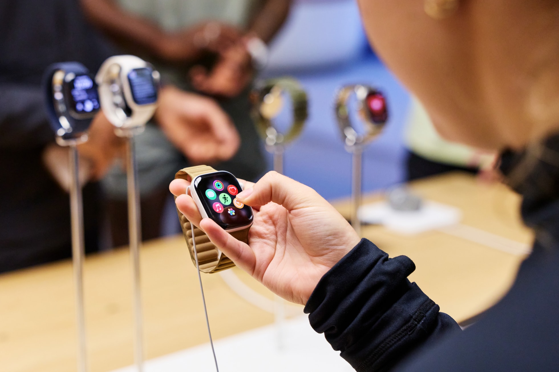 A customer browses features on Apple Watch Series 12 at Apple Covent Garden.