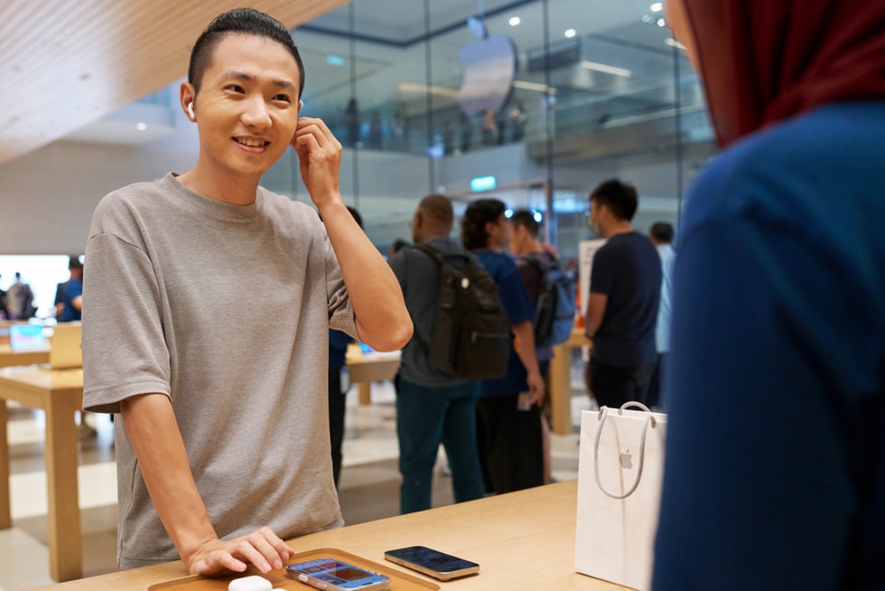 A customer tries out AirPods 5 at Apple The Exchange TRX.