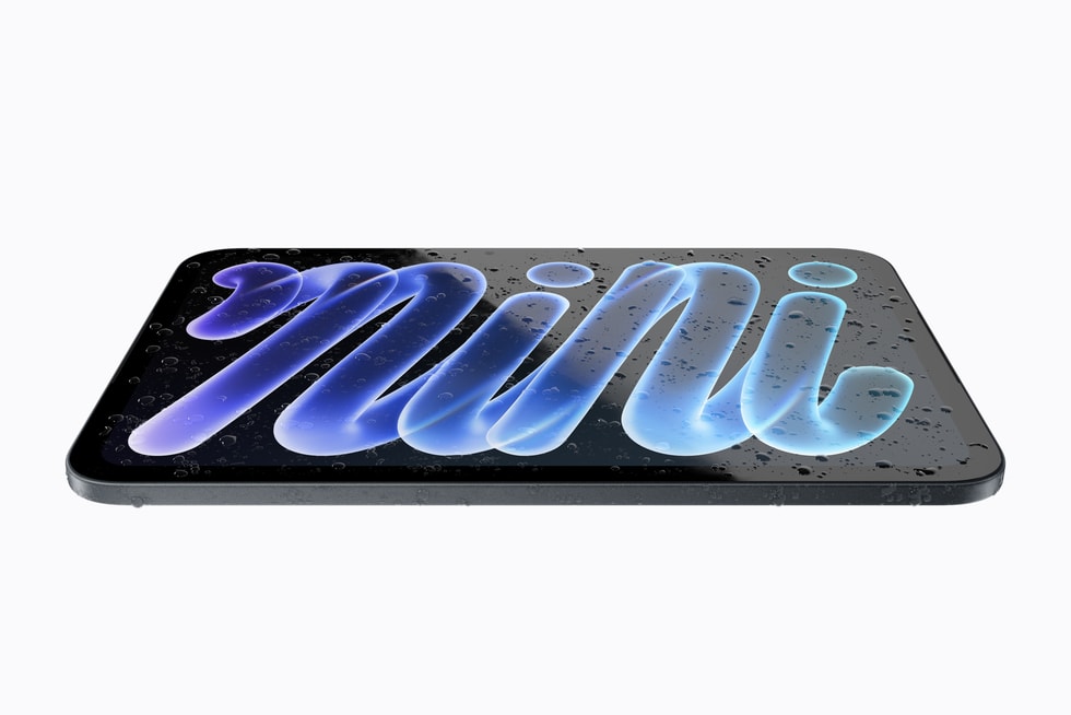 iPad mini is shown lying flat with droplets of water on it.