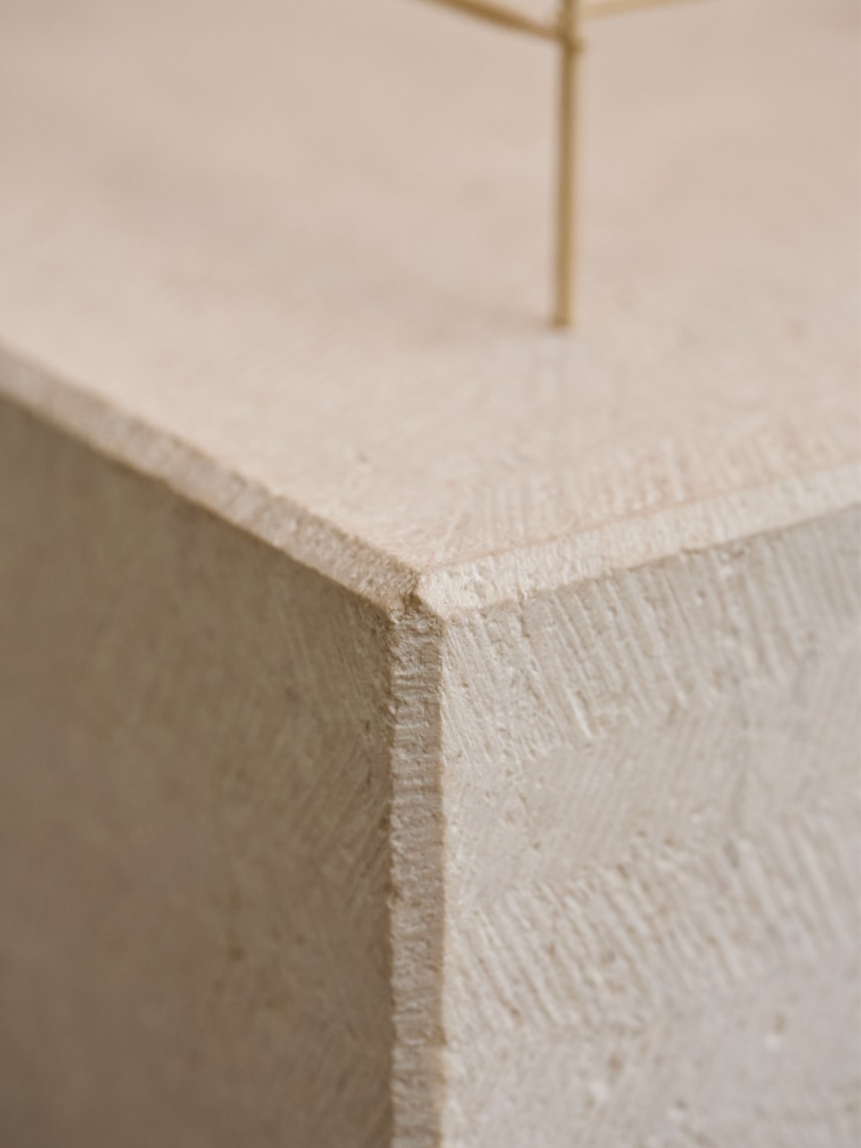 A close-up of the limestone base of “The Eminence of Light.”
