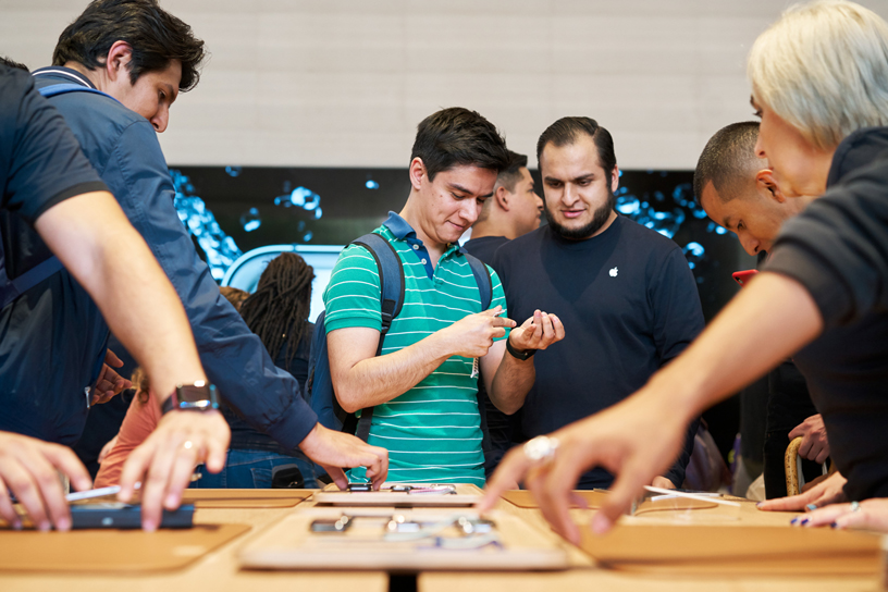 A customer tries on Apple Watch Series 5 at Apple Antara.