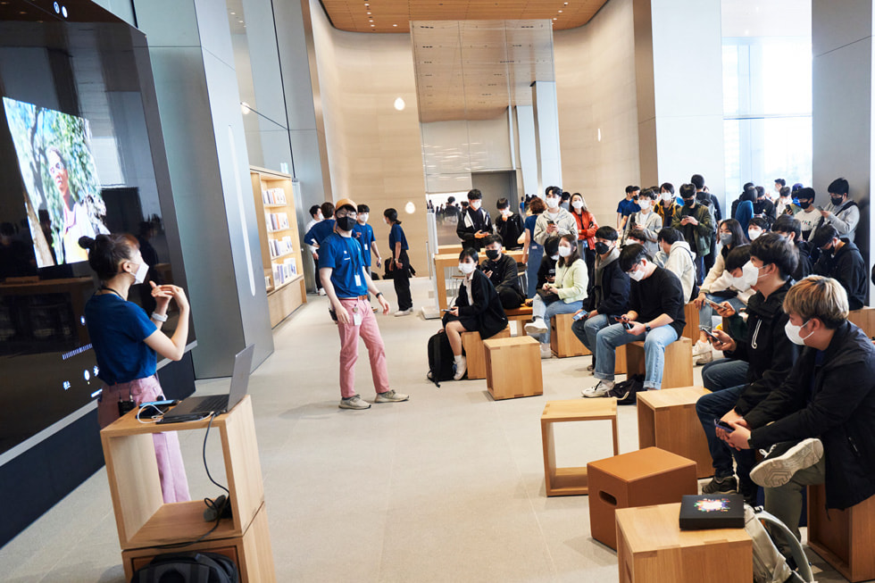 The Forum and the large video wall are shown at Apple Myeongdong.