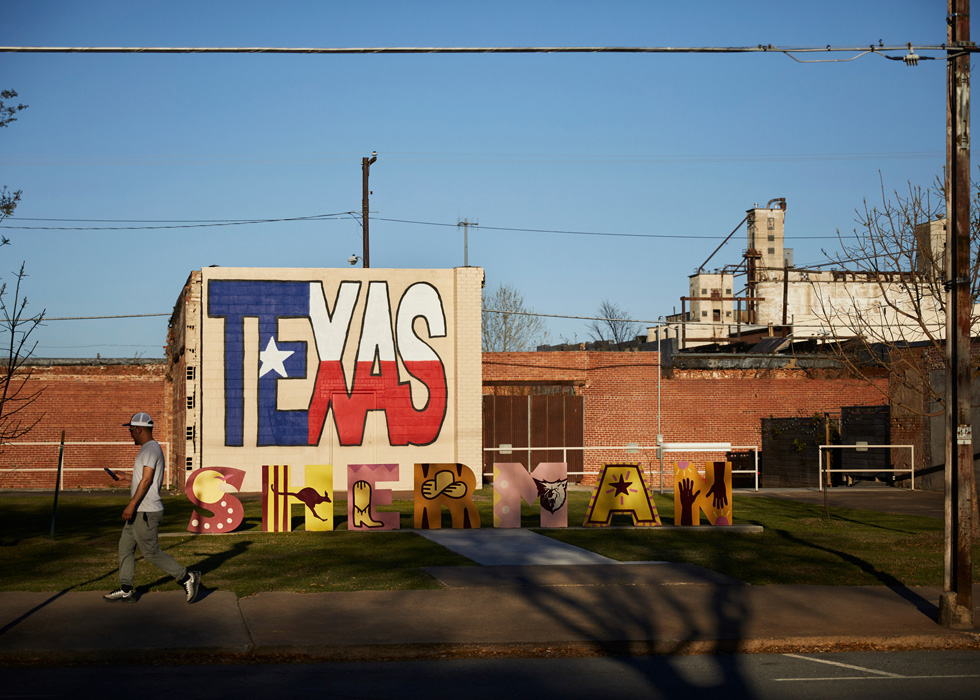 A graffitied wall in Sherman, Texas.