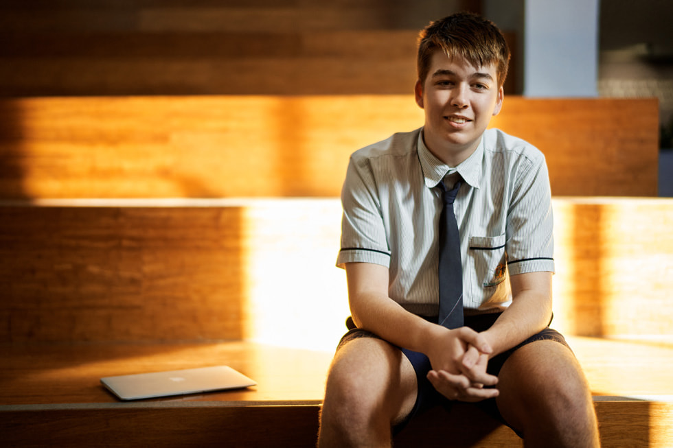 Lincoln Hetherington of St Augustine’s College, seated next to his MacBook Air.