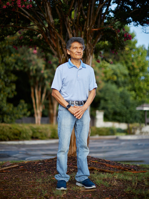 Regional One Health patient Lauro Salvador standing in front of a tree.