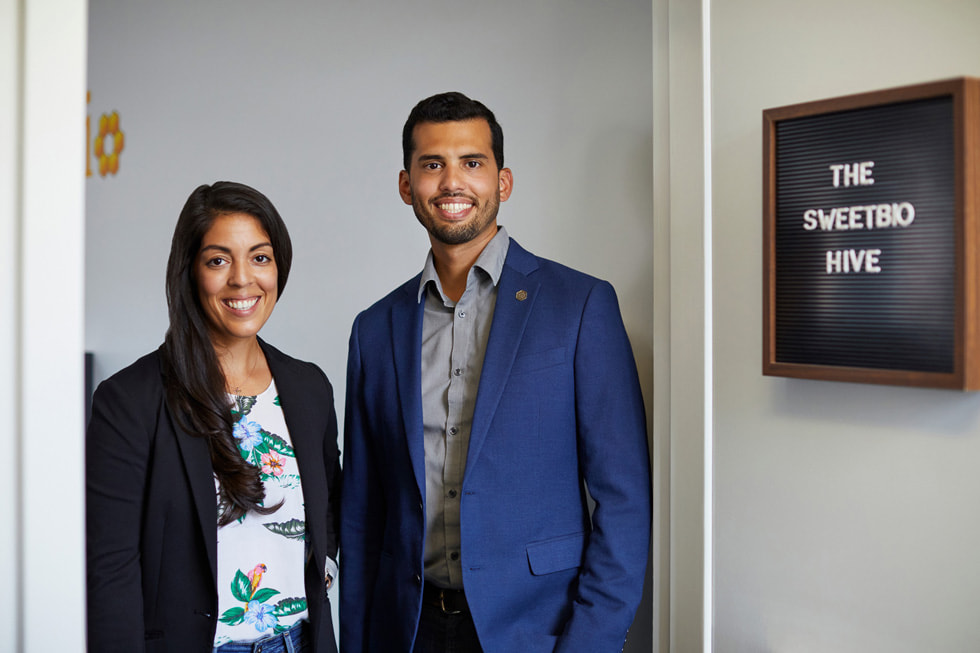 Kayla Rodriguez Graff and Isaac Rodriguez, co-founders of SweetBio, posing in front of their office.
