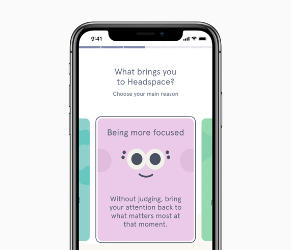 iPhone X showing Headspace App on screen.