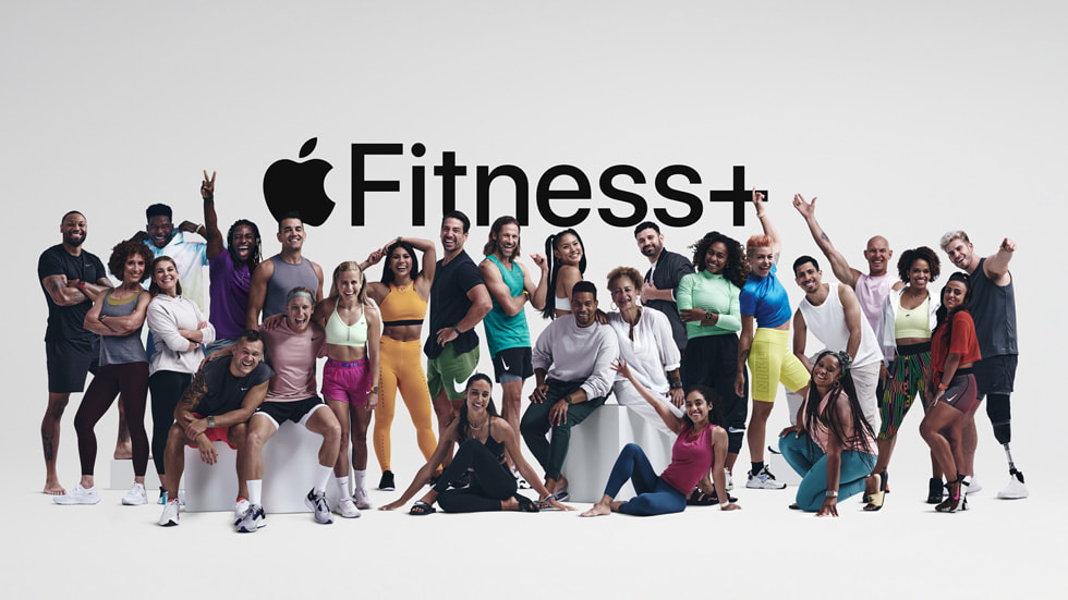 Group photo of the many Fitness+ trainers in front of an Apple Fitness+ logo.