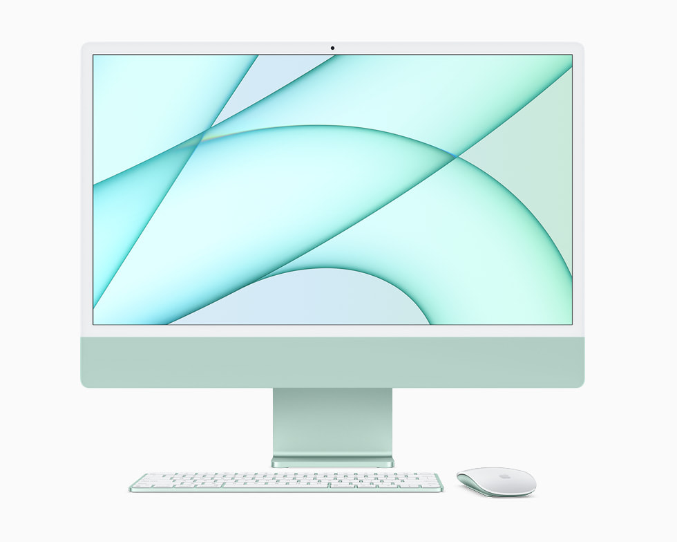 Green iMac displayed with Magic Keyboard and Magic Mouse.