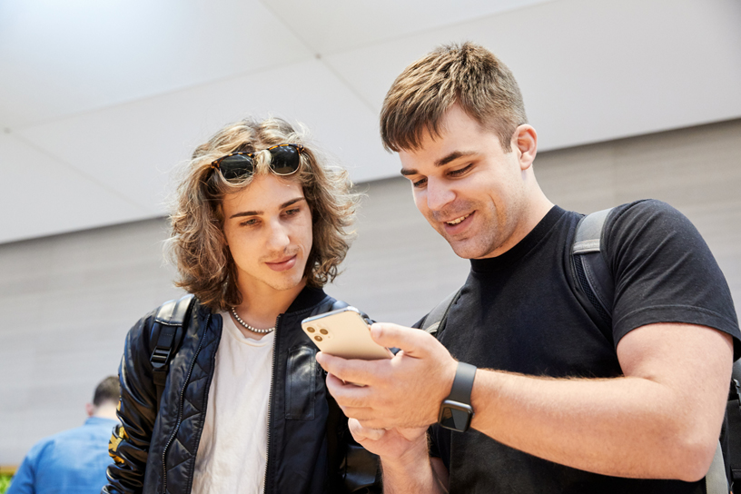 Customers explore the new features of iPhone 11 Pro.