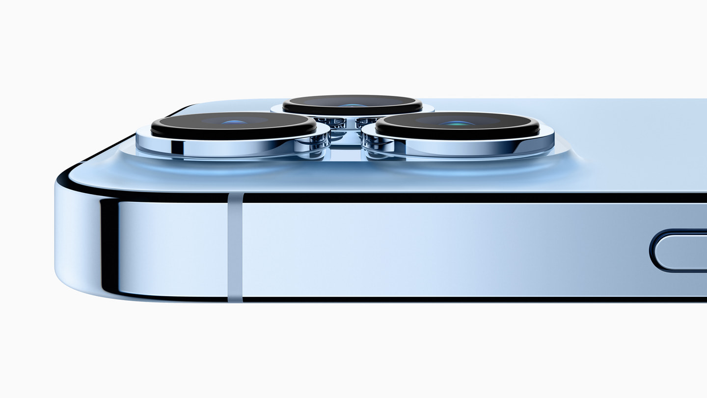 Closeup of iPhone 13 Pro’s camera system in sierra blue.