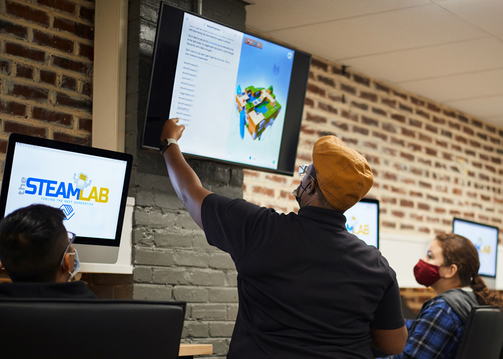 Mia Williams instructs a class using Everyone Can Code curriculum.