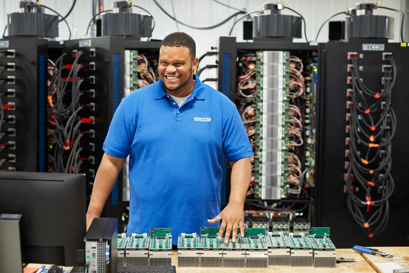 A Maccor employee portrait at the battery testing facility.