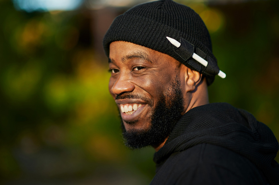 Mike Lang wearing a beanie with Apple Pencil attached.