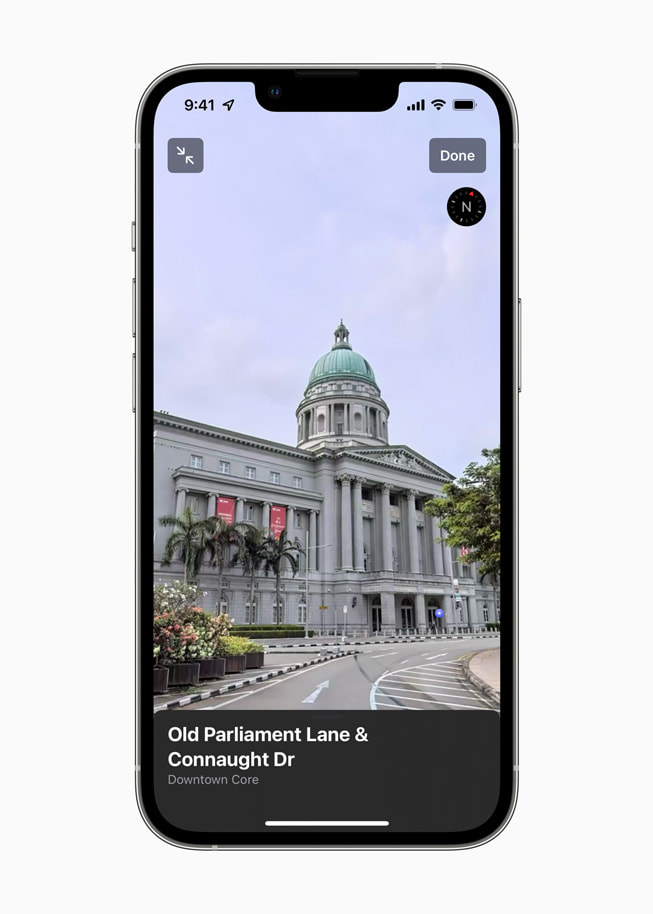 An iPhone screen shows Parliament Lane and Connaught Drive in Singapore on Apple Maps.