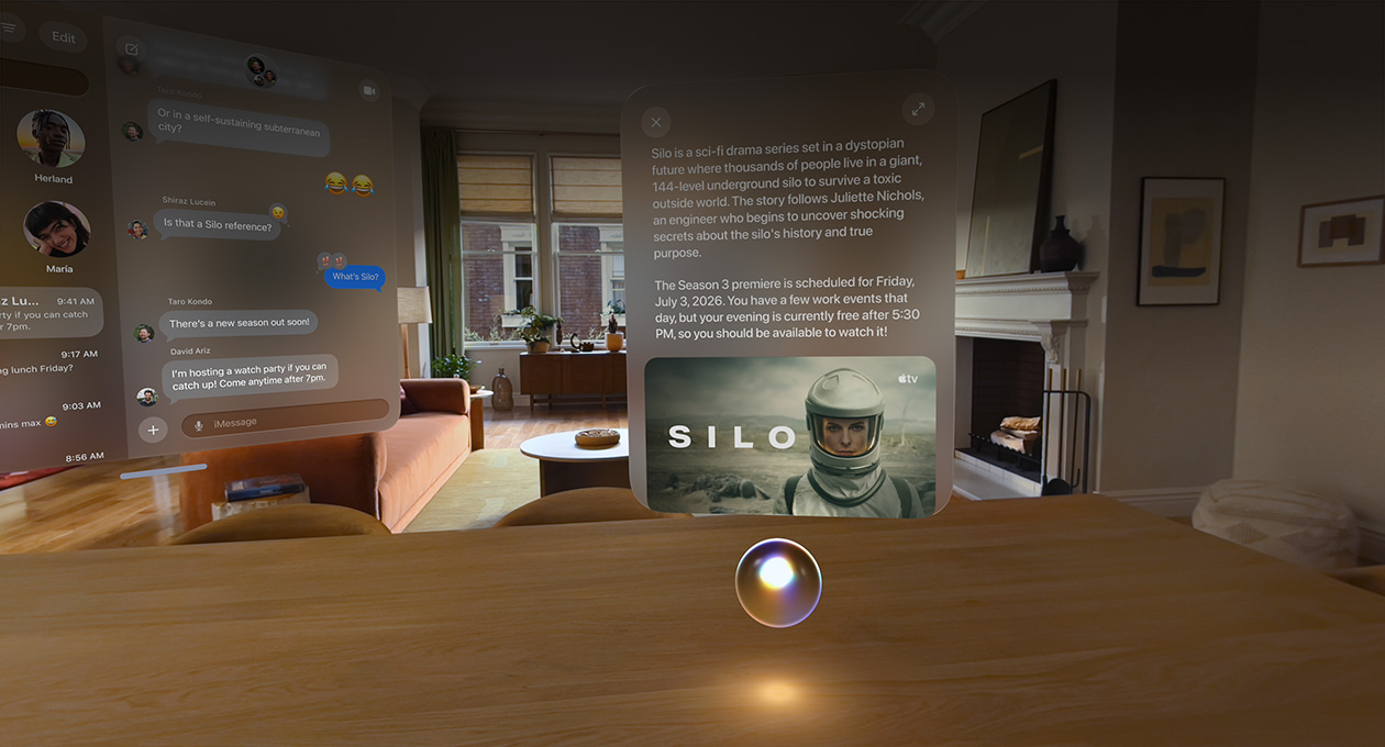 Apple Vision Pro being used in a living room, Messages conversation open to the left, Siri hovering over a bar counter in front of the user, a window above Siri shows a query and a response