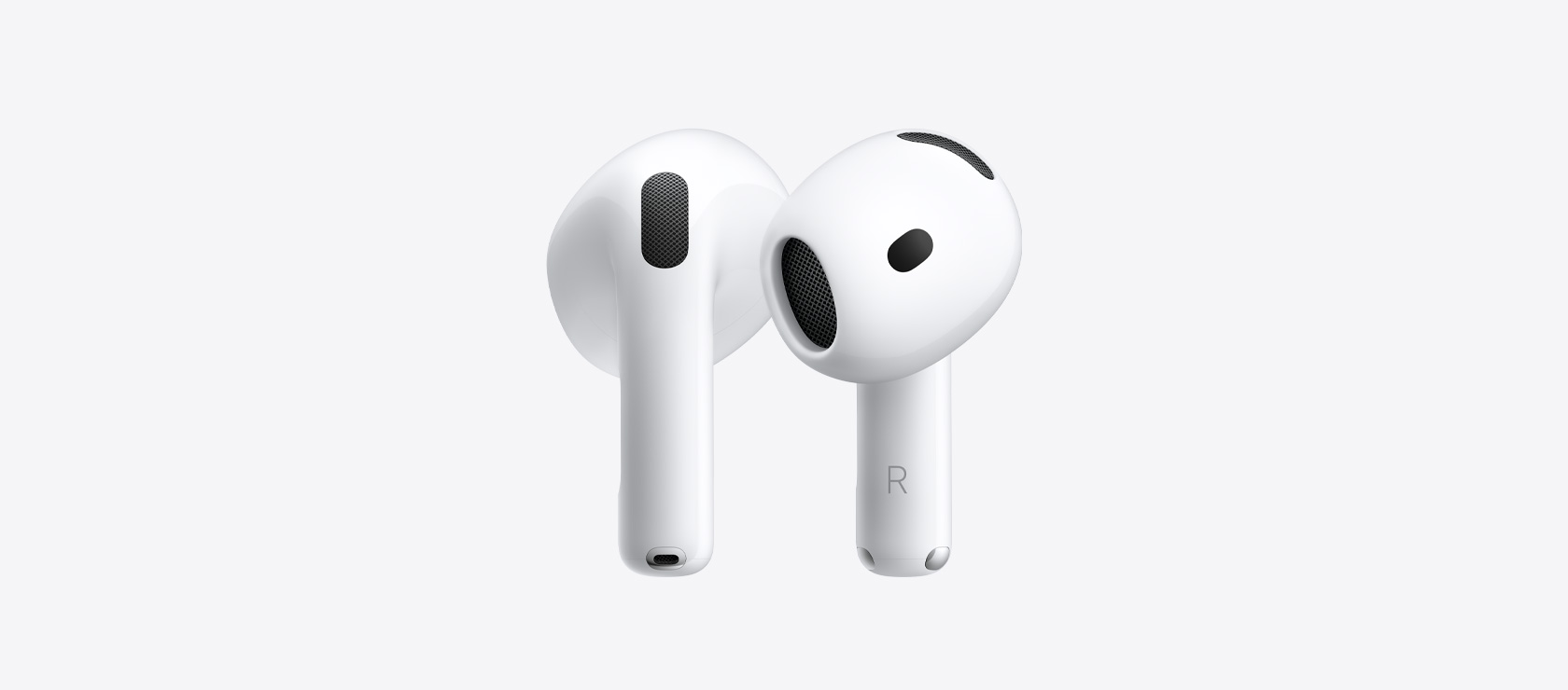 AirPods 5: ovale trådløse øretelefoner i hvid, øreprop med akustisk højttalernet på indersiden, kort stav med sølvfarvet opladningsstik, bogstavindikatorer for venstre og højre