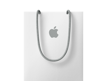 An Apple Store shopping bag, white color, with gray Apple logo and gray handles
