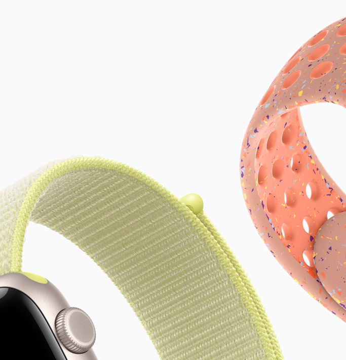 スターライトアルミニウムケースのApple Watch SE 3。ネオンイエローのスポーツループ、アルペングローピンクのNikeスポーツバンド